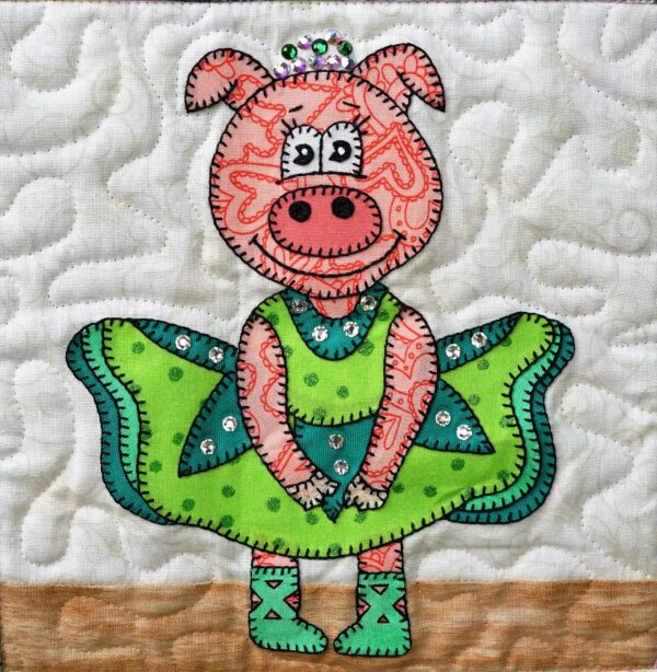 A quilt with Dance - Piggy in a green dress.