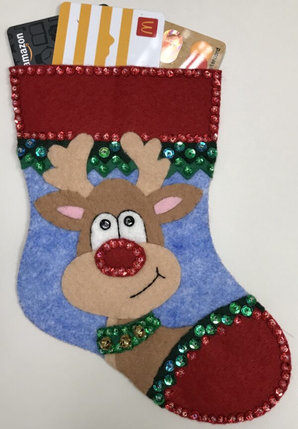 A felt reindeer stocking with Reindeer Gift Card Holder in it.