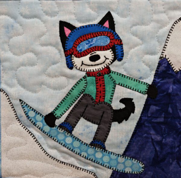 A quilt with a Husky - Snowboard riding a snowboard.