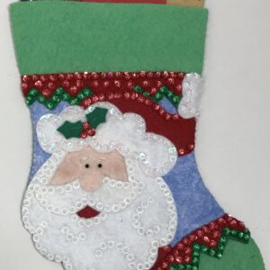 A Santa Gift Card Holder stocking with credit cards in it.