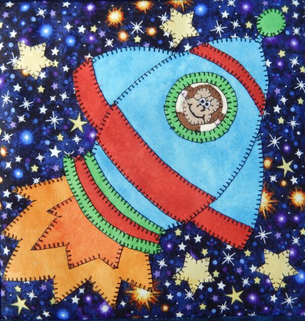 A quilt with the Space Race - Small Rocket and stars on it.