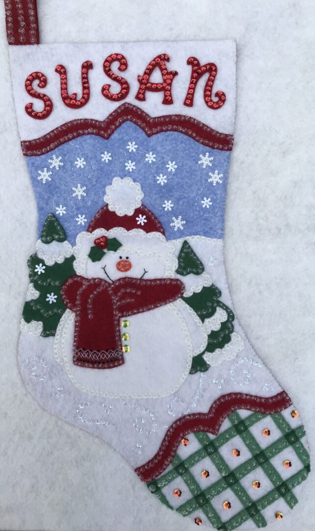 A Snowman Stocking with the name Susan on it.