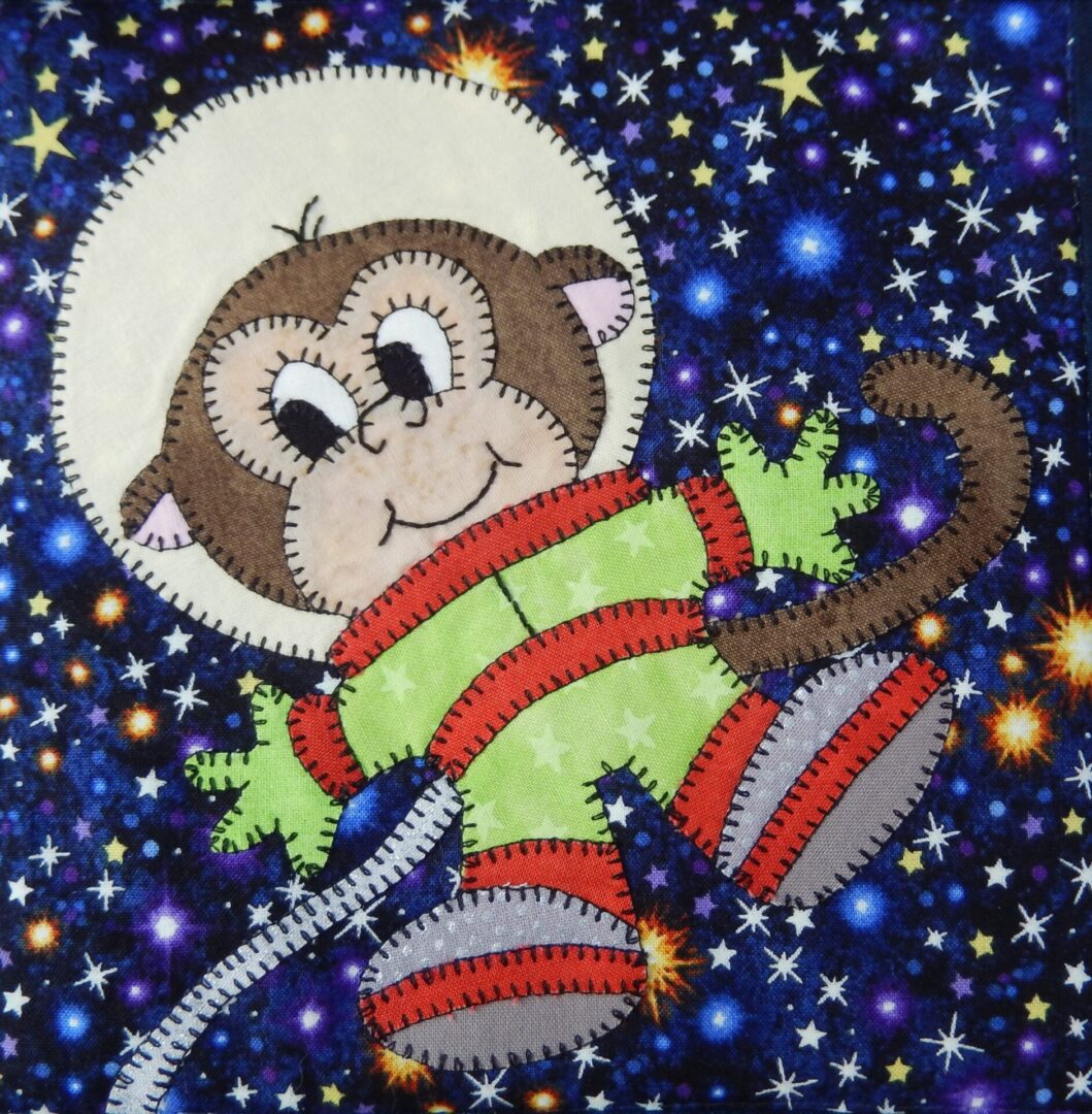 Space Race - Space Monkey is embroidered on a starry background.