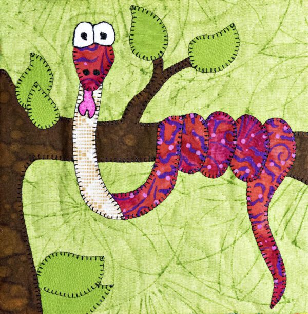 A Rainbow Boa quilt with a snake on a tree branch.