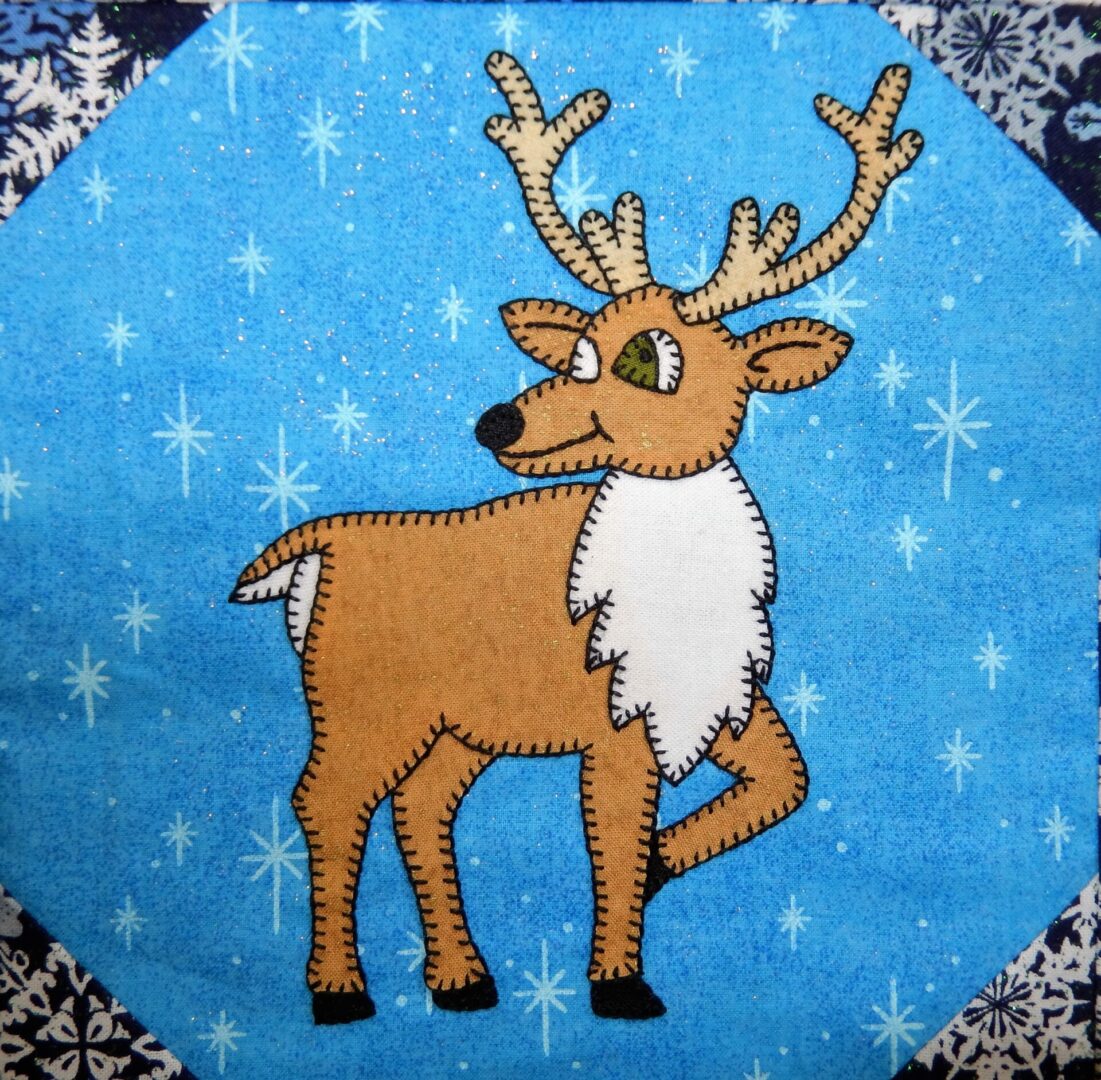 A quilt block with a Caribou on it.
