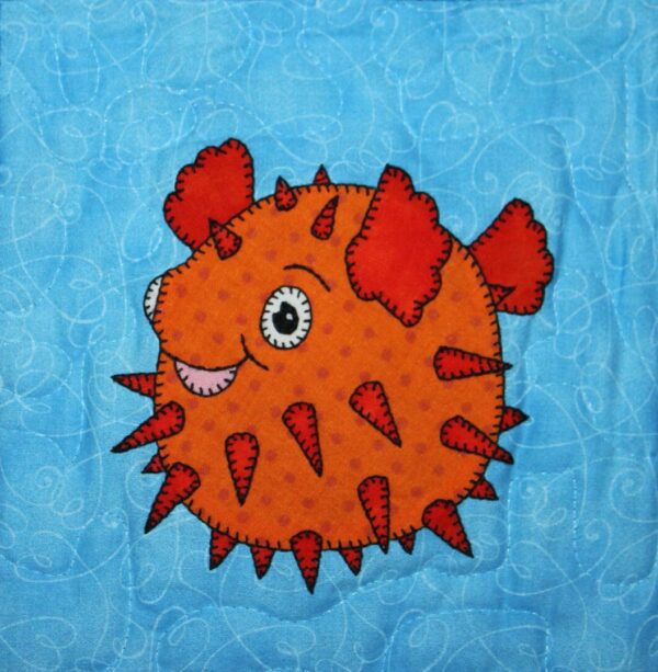 An Puffer Fish on a blue background.