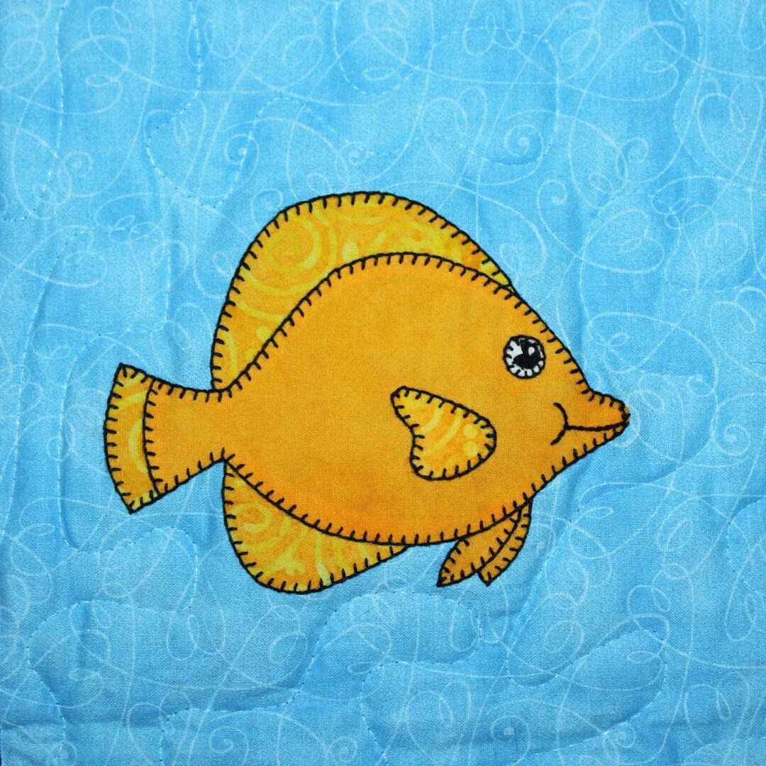 A Yellow Tang on a blue background.